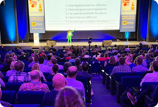 an audience attending a presentation at the gathering