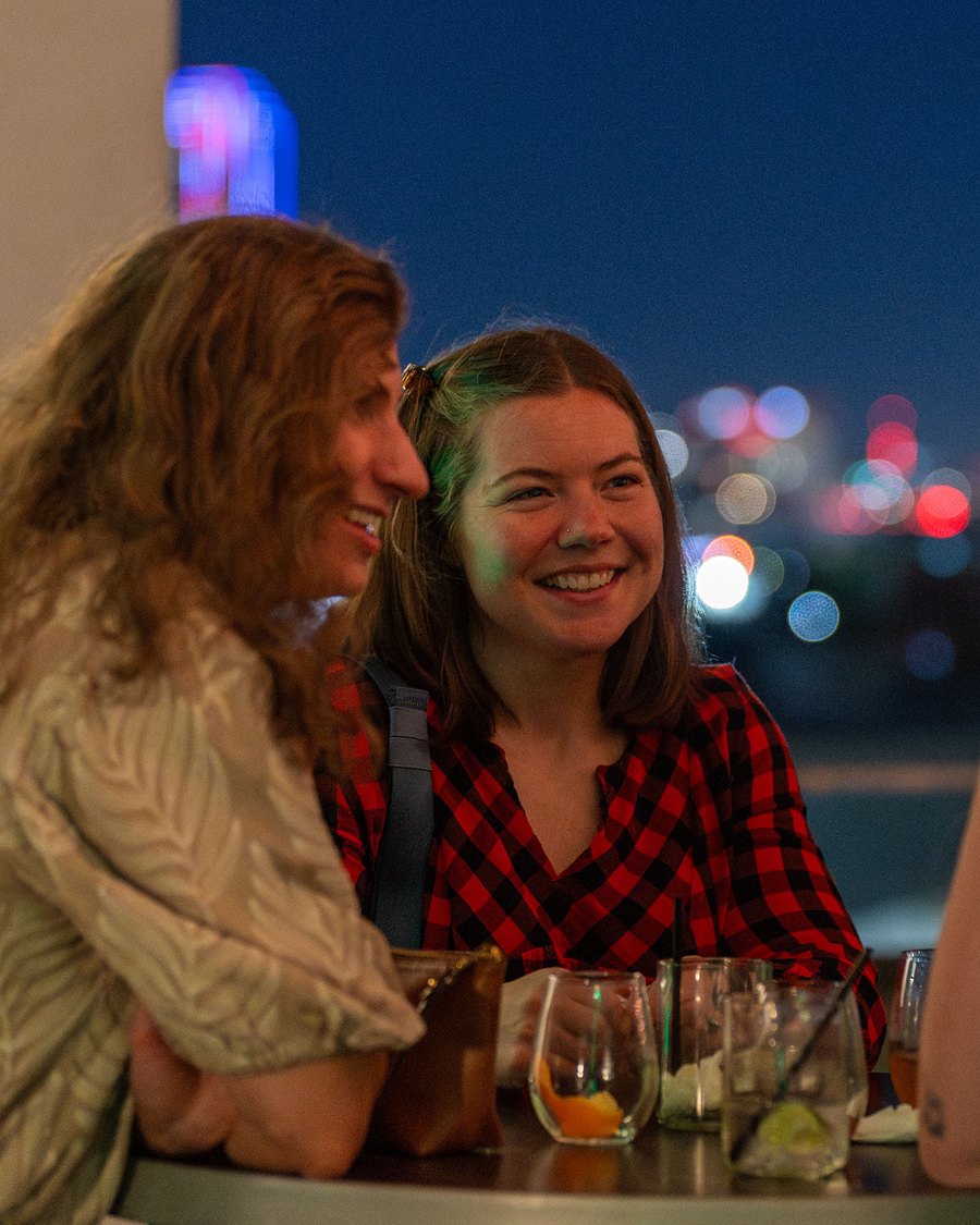 Attendees at the rooftop welcome reception, Pipeline 2025